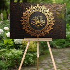 İslami Hat Sanatı Temperli Cam Tablo – “İzzu’l-Vilâd” (Evlatların Değeridir) Siyah & Altın Lüks Dini Dekor, Premium UV Baskı